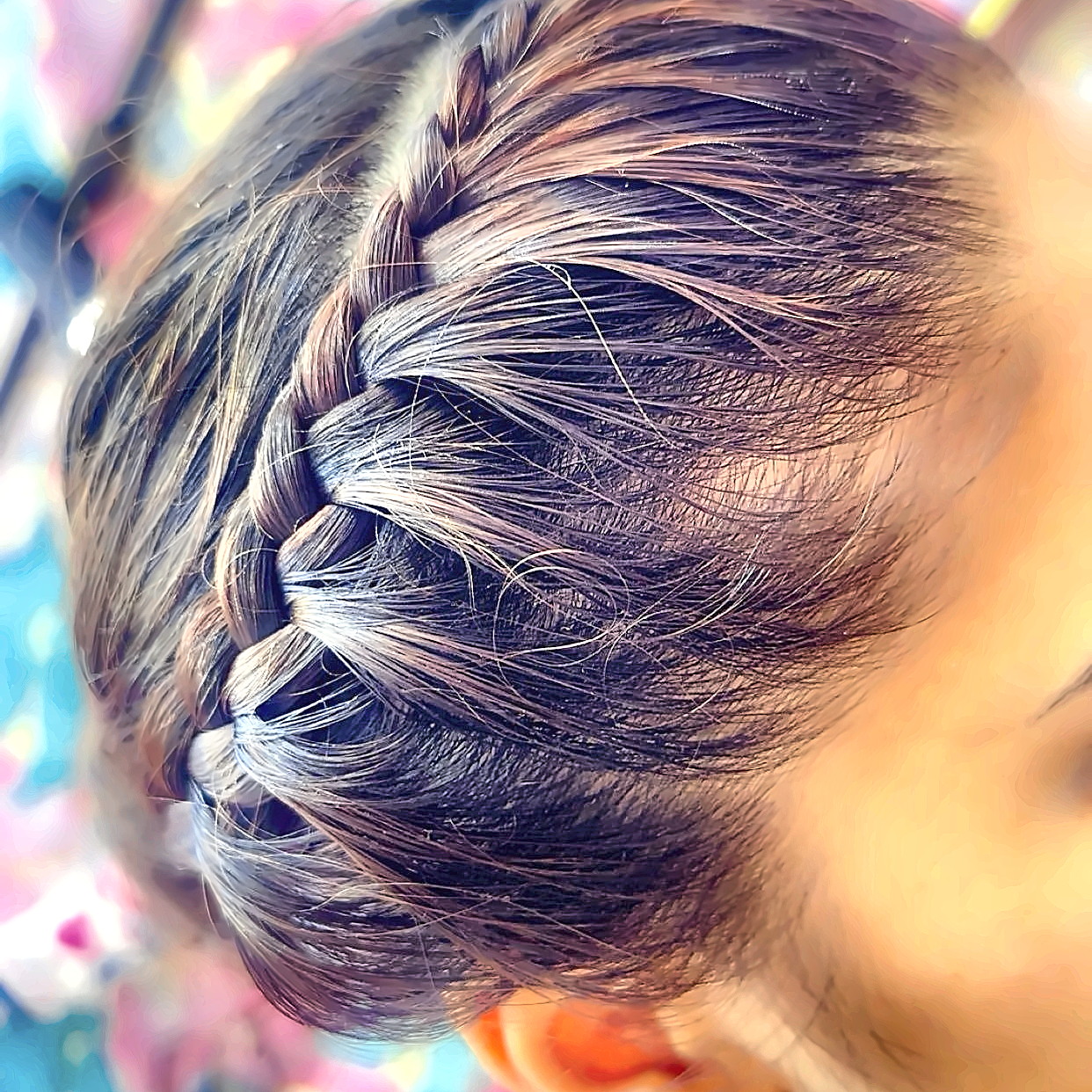 Neat crown braid worked close to the scalp as part of an updo
